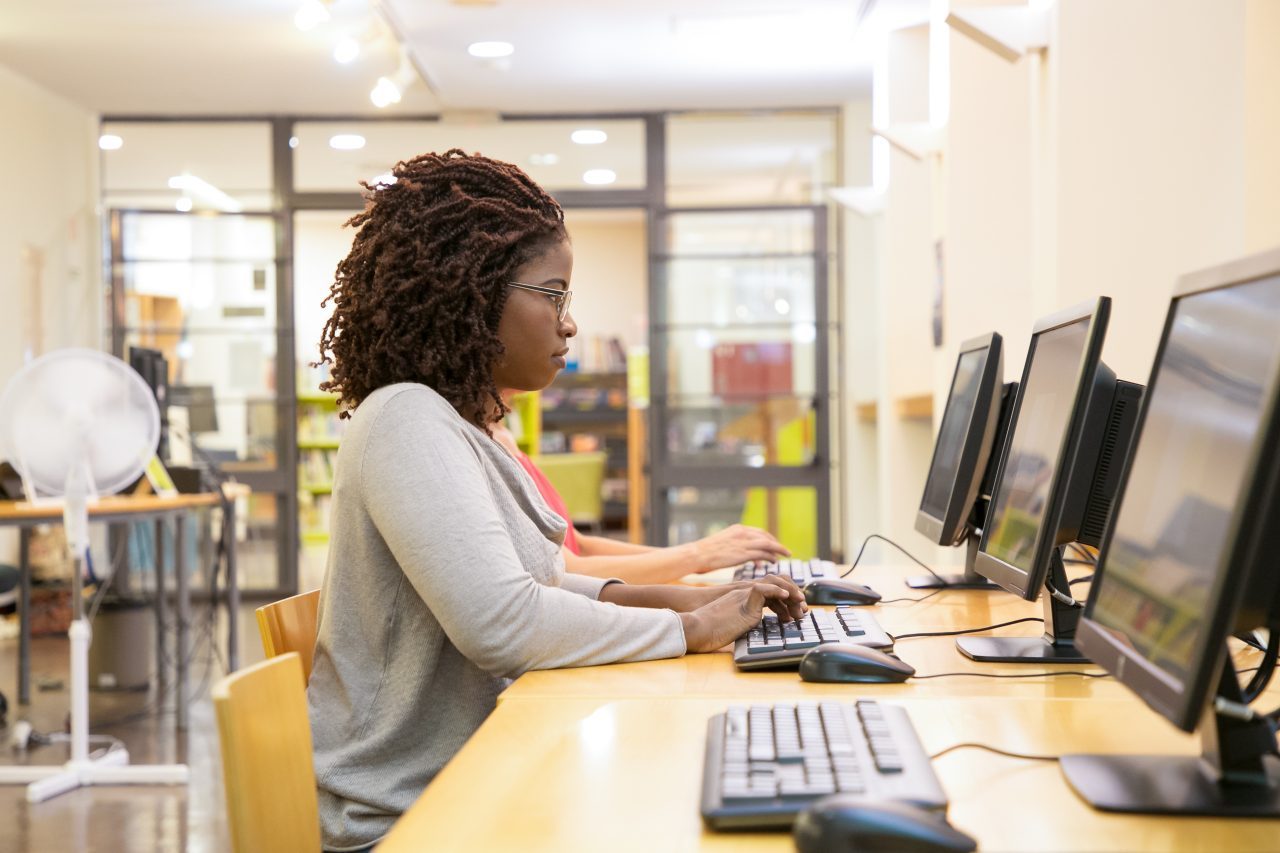 Side,View,Of,Focused,Woman,Typing,On,Computer,Keyboard.,Thoughtful